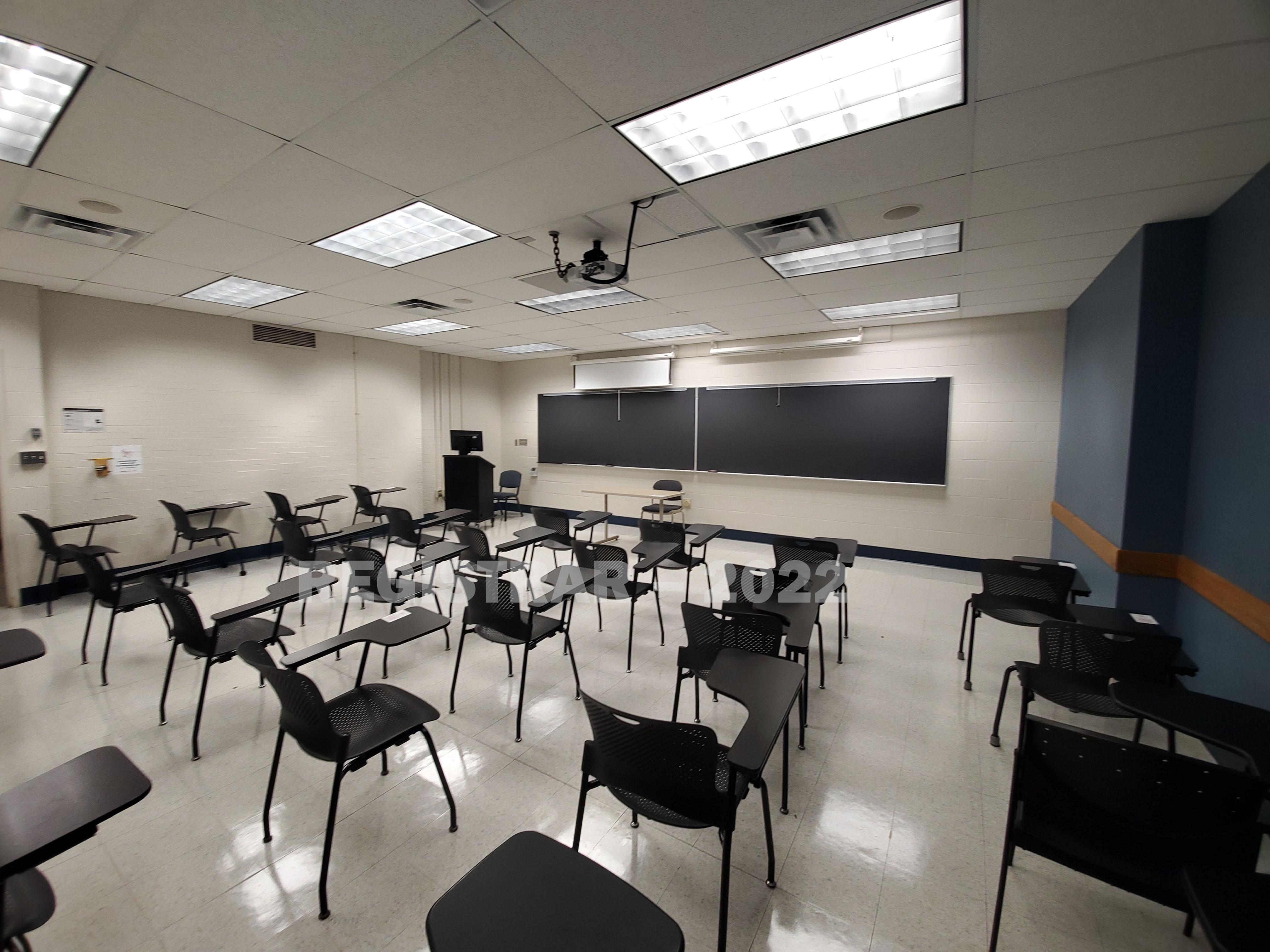 Journalism Building room 143 ultra wide angle view from the back of the room