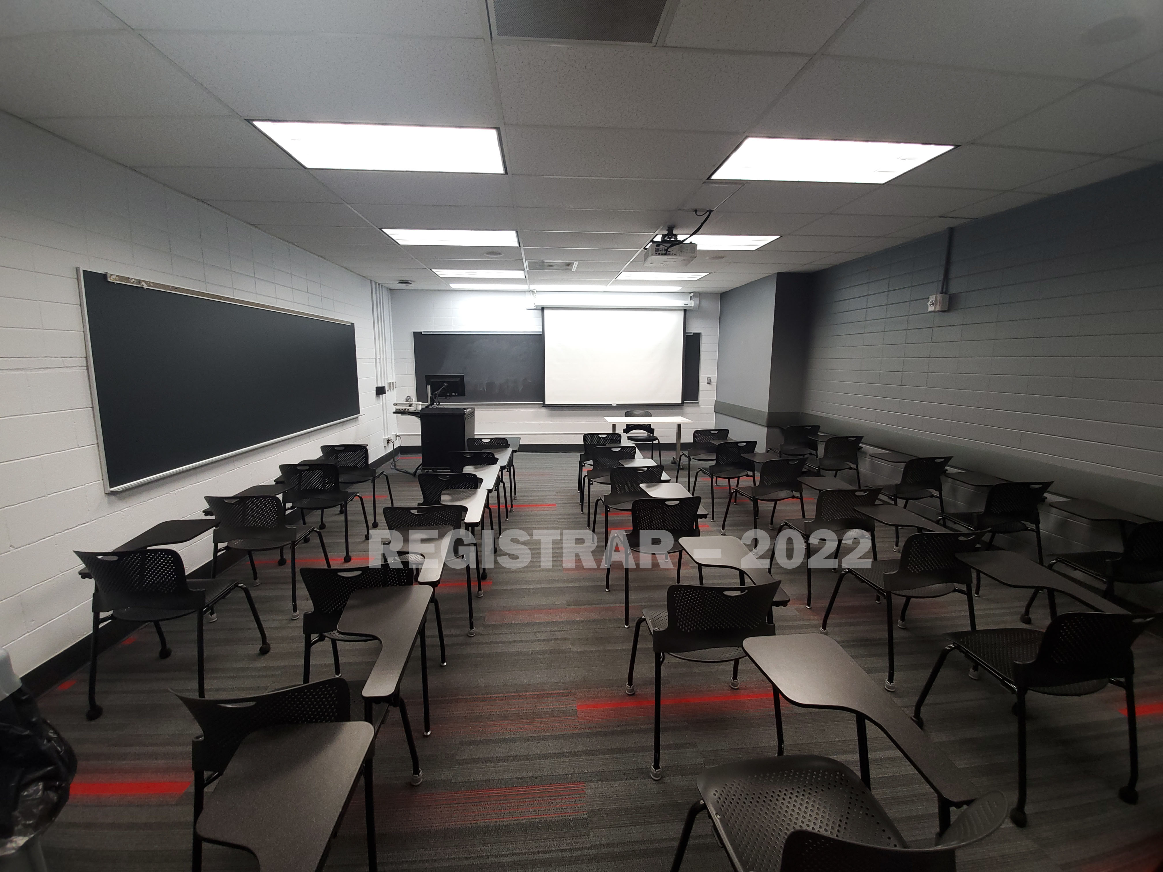 Baker Systems Engineering 130 ultra wide angle view from the back of the room with projector screen down