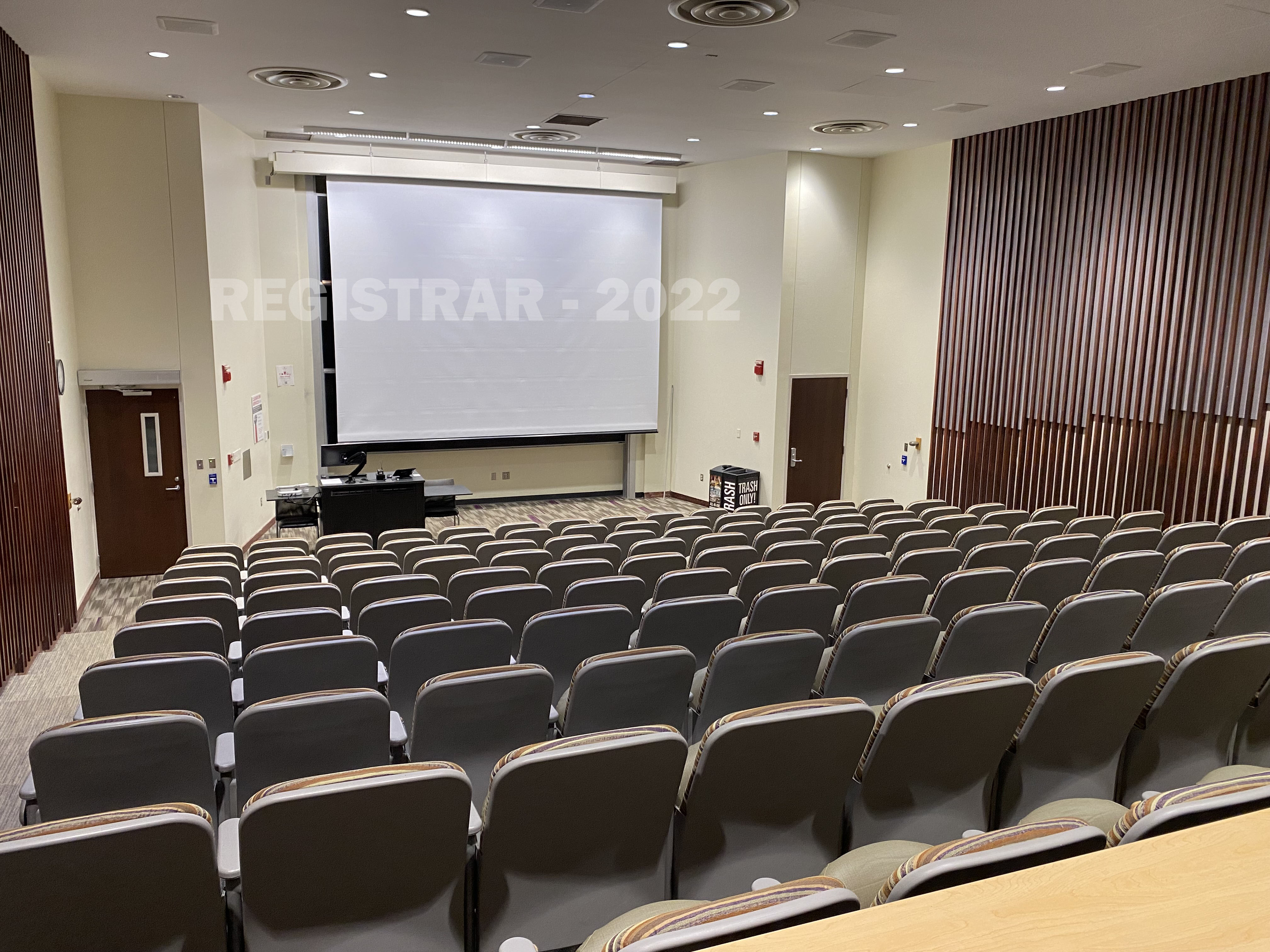 209 West Eighteenth Avenue room 170 view of back of room with screen down